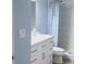 Updated bathroom with white vanity, shower, and blue walls at 112 Jose Gaspar Dr # 112, Englewood, FL 34223