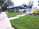 Community clubhouse with outdoor seating and American flag at 112 Jose Gaspar Dr # 112, Englewood, FL 34223