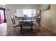 Small dining area with round table and four chairs at 112 Jose Gaspar Dr # 112, Englewood, FL 34223