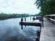 Wooden docks extending over calm water at 112 Jose Gaspar Dr # 112, Englewood, FL 34223