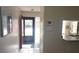 Bright entryway with tile floors and access to kitchen at 112 Jose Gaspar Dr # 112, Englewood, FL 34223