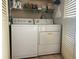 Stackable washer and dryer in convenient laundry closet at 112 Jose Gaspar Dr # 112, Englewood, FL 34223