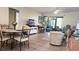 Comfortable living room with tiled floors and sliding doors at 112 Jose Gaspar Dr # 112, Englewood, FL 34223
