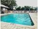 Refreshing community pool with a covered patio area at 112 Jose Gaspar Dr # 112, Englewood, FL 34223