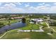 Expansive aerial view of the community and golf course at 1206 Tuscany Blvd, Venice, FL 34292
