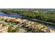 Aerial view of single Gathering home, situated on a tranquil canal at 1206 Tuscany Blvd, Venice, FL 34292