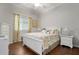 Bright bedroom with hardwood floors and a cozy atmosphere at 1206 Tuscany Blvd, Venice, FL 34292