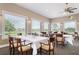 Bright dining room with large windows and seating for many at 1206 Tuscany Blvd, Venice, FL 34292