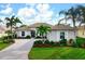 Stunning curb appeal! This home features a beautifully landscaped yard and a spacious driveway at 1206 Tuscany Blvd, Venice, FL 34292