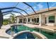 Expansive pool and spa area with screened-in patio at 1206 Tuscany Blvd, Venice, FL 34292