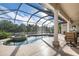 Relaxing pool and spa area with a screened enclosure at 1206 Tuscany Blvd, Venice, FL 34292