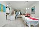 White table, eight chairs, and festive decor at 12391 Amica Loop, Venice, FL 34293