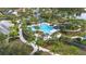 Resort-style pool with water slide and lush landscaping at 12460 Shimmering Oak Cir, Venice, FL 34293