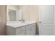 Clean bathroom with white vanity and large mirror at 12460 Shimmering Oak Cir, Venice, FL 34293