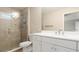 Bathroom with glass shower and white vanity at 12460 Shimmering Oak Cir, Venice, FL 34293