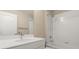 Bathroom featuring a shower/tub combo and white vanity at 12460 Shimmering Oak Cir, Venice, FL 34293