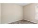 Bright bedroom with wood-look floors and a window at 12460 Shimmering Oak Cir, Venice, FL 34293