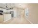 Open dining area with tile floors and kitchen views at 12460 Shimmering Oak Cir, Venice, FL 34293