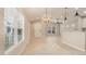 Bright dining room with tile floors and a chandelier at 12460 Shimmering Oak Cir, Venice, FL 34293