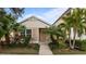 Charming cottage style home with landscaped walkway at 12460 Shimmering Oak Cir, Venice, FL 34293