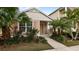 Charming house exterior with landscaped front yard and walkway at 12460 Shimmering Oak Cir, Venice, FL 34293