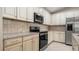 Updated kitchen featuring granite countertops and stainless steel appliances at 12460 Shimmering Oak Cir, Venice, FL 34293
