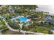 Large community pool with water slide and lounge areas at 12460 Shimmering Oak Cir, Venice, FL 34293