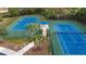 Two well-maintained community tennis courts at 12460 Shimmering Oak Cir, Venice, FL 34293