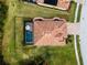 Bird's eye view of a house with a tile roof and pool at 12950 Basilica Dr, Venice, FL 34293