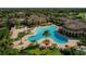 Resort-style pool, clubhouse, and tennis courts at 12950 Basilica Dr, Venice, FL 34293