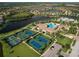 Community overview featuring pool, tennis, and homes at 12950 Basilica Dr, Venice, FL 34293