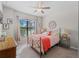 Spacious bedroom with a queen bed and ceiling fan at 12950 Basilica Dr, Venice, FL 34293