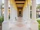 Elegant walkway with columns and tile at 12950 Basilica Dr, Venice, FL 34293