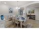 Elegant dining room with a large table and coastal decor at 12950 Basilica Dr, Venice, FL 34293