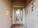 Inviting front door with a stained-glass design and welcome mat at 12950 Basilica Dr, Venice, FL 34293
