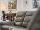 Relaxing living room with plush grey sofas at 12950 Basilica Dr, Venice, FL 34293