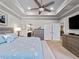 Main bedroom with king bed and access to the bathroom and sitting area at 12950 Basilica Dr, Venice, FL 34293