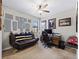 Home office with desk, computer, seating, and sports memorabilia at 12950 Basilica Dr, Venice, FL 34293