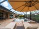 Luxury pool and spa with covered patio and lounge chairs at 12950 Basilica Dr, Venice, FL 34293