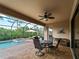 Enjoy relaxing moments in this screened-in pool area with patio furniture at 12950 Basilica Dr, Venice, FL 34293