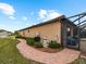 Well-maintained pool equipment and brick pathway at 12950 Basilica Dr, Venice, FL 34293