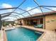 Large, refreshing pool with spa and screened enclosure at 12950 Basilica Dr, Venice, FL 34293