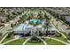 Aerial view of community pool, playground, and homes at 13237 Satin Lily Dr, Riverview, FL 33579