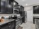 Well-equipped kitchen with dark wood cabinets at 13237 Satin Lily Dr, Riverview, FL 33579