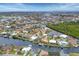 Aerial view showcasing waterfront homes and lush landscaping at 1371 Grebe Dr, Punta Gorda, FL 33950