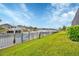 Landscaped backyard with canal access and lush greenery at 1371 Grebe Dr, Punta Gorda, FL 33950