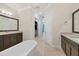 Bathroom with free-standing tub and double vanity at 1371 Grebe Dr, Punta Gorda, FL 33950