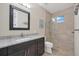 Bathroom with shower, toilet and single vanity at 1371 Grebe Dr, Punta Gorda, FL 33950