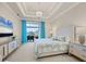 Main bedroom with a plush bed, large TV, and access to the balcony at 1371 Grebe Dr, Punta Gorda, FL 33950