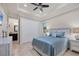 Guest bedroom with queen-size bed and ensuite bathroom at 1371 Grebe Dr, Punta Gorda, FL 33950